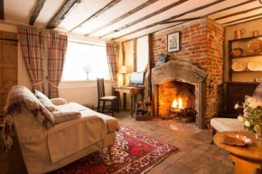 Spadgers, a flax workers cottage next to fields in a Medieval Village